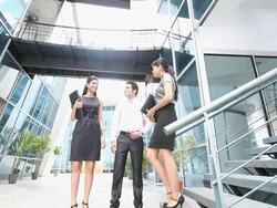Three business people talking  Stock Footage