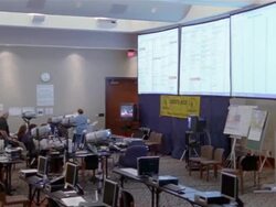 September 2005 High angle wide shot pan volunteers working on computers at Hurricane Katrina relief command center / Alpharetta, Georgia Stock Footage