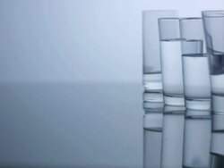 Glasses filled with water, slow motion Stock Footage