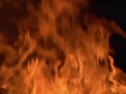 ECU SLO MO Shot of Fire flames in campfire, campsite / Moremi Reserve, Africa, Botswana Stock Footage