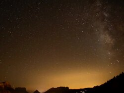 WS T/L  Milky way moving over city with traffic going through / Sedona,  Arizona, United States Stock Footage