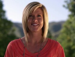 Static shot of attracive blond woman smiling in a light breeze. Stock Footage