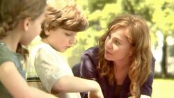 CU, SELECTIVE FOCUS, USA, New York State, Bedford Hills, woman assisting son and daughter (6-9 years) in planting seeds in pots Stock Footage