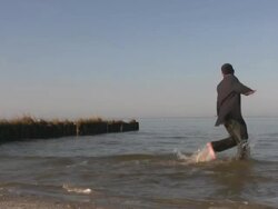 Business man at the beach Stock Footage