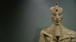 A statue of Amenophis IV casts a shadow on a museum wall in Luxor, Egypt. Stock Footage