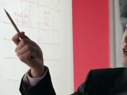 CU SELECTIVE FOCUS PAN Two businessmen talking and pointing to whiteboard / China Stock Footage