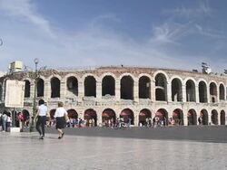 MS Tourists roaming in front of Arena di Verona at Piazza Bra / Verona, Veneto, Italy Stock Footage
