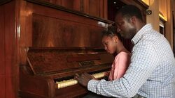 Father and Daughter play piano Stock Footage