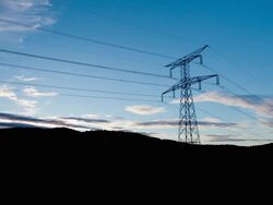 Time lapse zoom of electrical lines and pylon at sunset Stock Footage