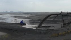 Panoramic view left to right across the radioactive toxic tailings lake at the rear of the Baogang Iron and Steel plant in Baotou China The lake is full of heavy metals and rare earths and over 10km wide Stock Footage