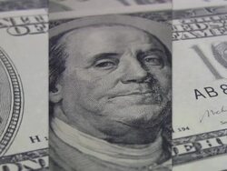 Quarter coins spinning over hundred dollars bill. Currency. Finance. Money. Stock Footage