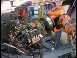 CU Robots working on cars in factory production line Stock Footage