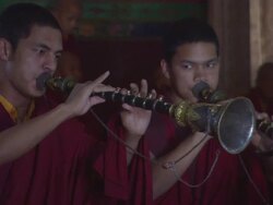 MS ZO PAN Monks playing horn instrument, kangling, during band practice / Kathmandu, Central Region,Nepal Stock Footage