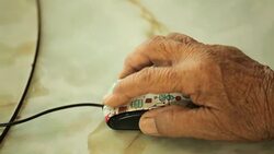 Senior woman Using Computer Mouse at home Stock Footage