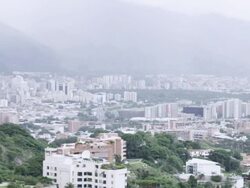 WS PAN View of cityscape located near mountain / Caracas, Venezuela Stock Footage
