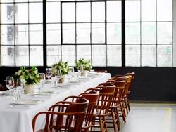 MS waitress setting banquet table for dinner party in loft Stock Footage