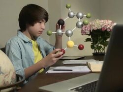 Latin Teen Learns Science by Studying Model of a Molecule Stock Footage