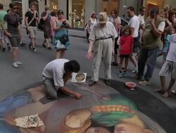 WS TD Tourists Watching Street Artist Painting on Sidewalk / Florence, Italy Stock Footage