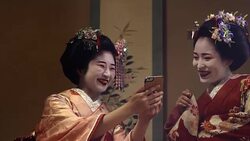 Geisha Maiko Using Mobile  UHD 4K Stock Footage