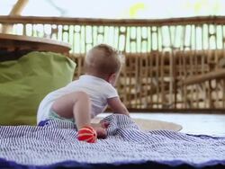 MS Shot of baby sitting up on floor / Ubud, Bali, Indonesia Stock Footage