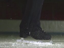 Close Up, Locked Down - A figure skater spins on the ice / USA Stock Footage