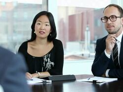 MS DS three coworkers in discussion at conference room table/Seattle, Washington, USA  Stock Footage