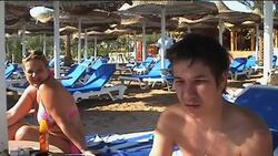 Beach scenes, tourist reax after swimmer killed by shark News Clip