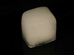 T/L Ice Cube melting Stock Footage