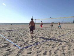 Men playing beach volleyball. Stock Footage