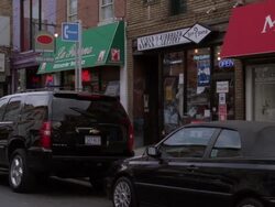 MS PAN View of small shops/retail stores near street and  heavy traffic on street / Philadelphia, Pennsylvania, United States Stock Footage
