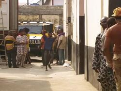 WS View of truck with people taking old televisions out of truck / Lagos, Nigeria Stock Footage
