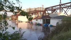 Flood waters wash trash against houses in Cedar Rapids, Iowa. Stock Footage