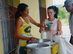 MS Shot of rations for food supplies with very little milk poured for people for one month welfare 14 / Trinidad, Cuba Stock Footage