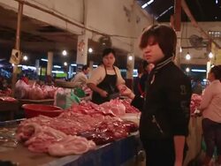 MS POV SLO MO Meat stall owners cutting and chpping meat at meat market / h / Vientiane, Laos Stock Footage