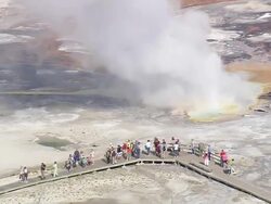 MS AERIAL Shot of tourists walking on walkway near hot water fountain group at Yellowstone National Park / Wyoming, United States Stock Footage