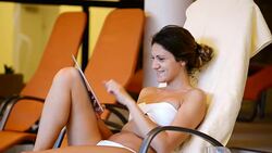 Healthy woman enjoys relaxing day at spa centre in swimsuit Stock Footage