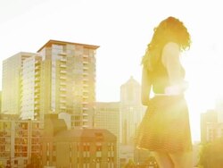 Woman on rooftop of building Stock Footage