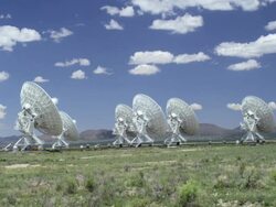 Very Large Array Radio Telescopes near Socorro, New Mexico, USA. Fluffy clouds Stock Footage