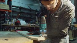 Woman Shaping Wood with Jigsaw Stock Footage