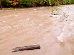 MS PAN View of Muddy flood stream with Sawkill Creek / Saugerties, New York, United States Stock Footage