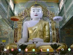 MS LA Shot of Buddha figure in Sun U Ponnya Shin Pagoda / Sagaing, Mandalay, Mandalay Division, Myanmar Stock Footage