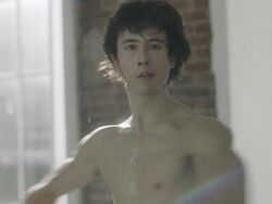 Portrait of  Male Ballet dancer rehearsing spin in dance studio Stock Footage