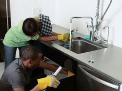 Couple doing plumbing Stock Footage