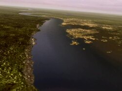 Wide Shot aerial push-in - An aerial of the River Thames before settlement transforms into the river flowing through contemporary London. / London, United Kingdom Stock Footage
