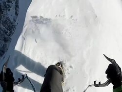 POV of mountain climbing in the snow using crampons and ice axes. - Model Released - HD Stock Footage