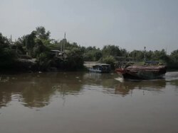 BOAT POV WS PAN Boat Floating down River / Hoi An, Vietnam Stock Footage