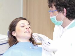 Dentist checking teeth color Stock Footage