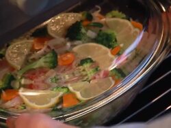 Bake tilapia with vegetables, dietary dish Stock Footage