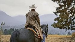 SLO MO Herdsman riding his horse on mountain Stock Footage