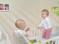 HD: Two Toddlers Exploring The Crib Stock Footage